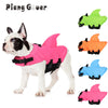 Pink and green waterproof life vests for dogs shown in various colors and sizes