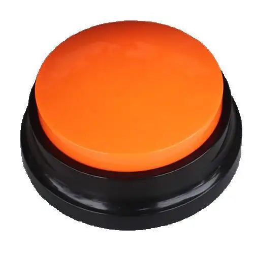 An orange pet communication recording button with a black base.