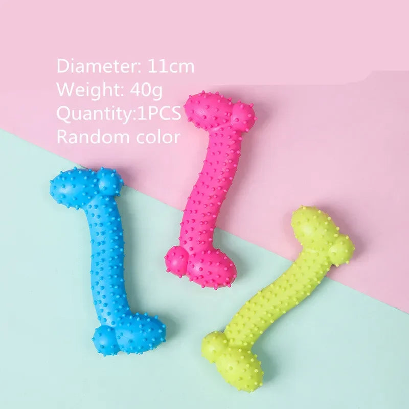 Three rubber chew toys shaped like the number 1, in blue, pink, and yellow, displayed on a light background.
