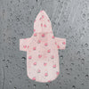 Pink cartoon printed dog raincoat for small breeds with a hood and button closure