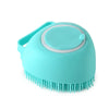 A light blue silicone pet bathing massage glove with a handle and a rounded head.