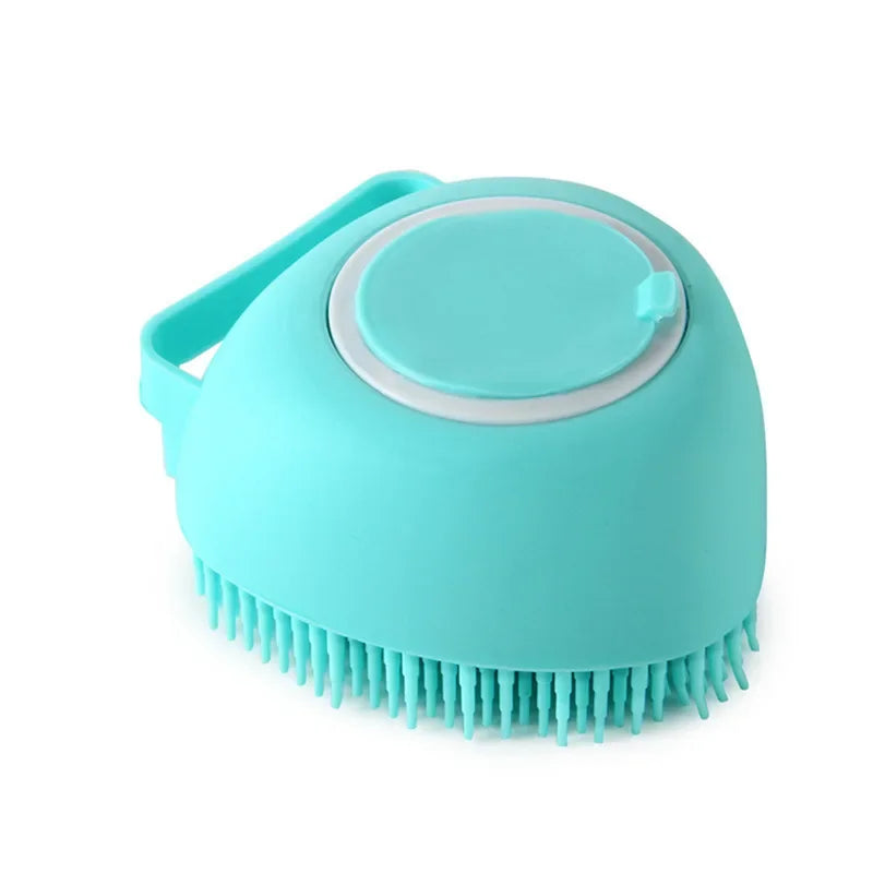 A light blue silicone pet bathing massage glove with a handle and a rounded head.