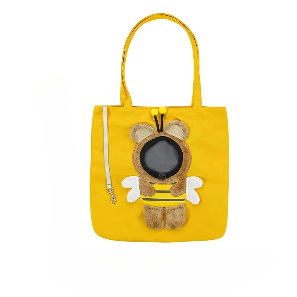 A yellow portable crossbody pet carrier bag featuring a bear face design with black eyes and yellow ears.