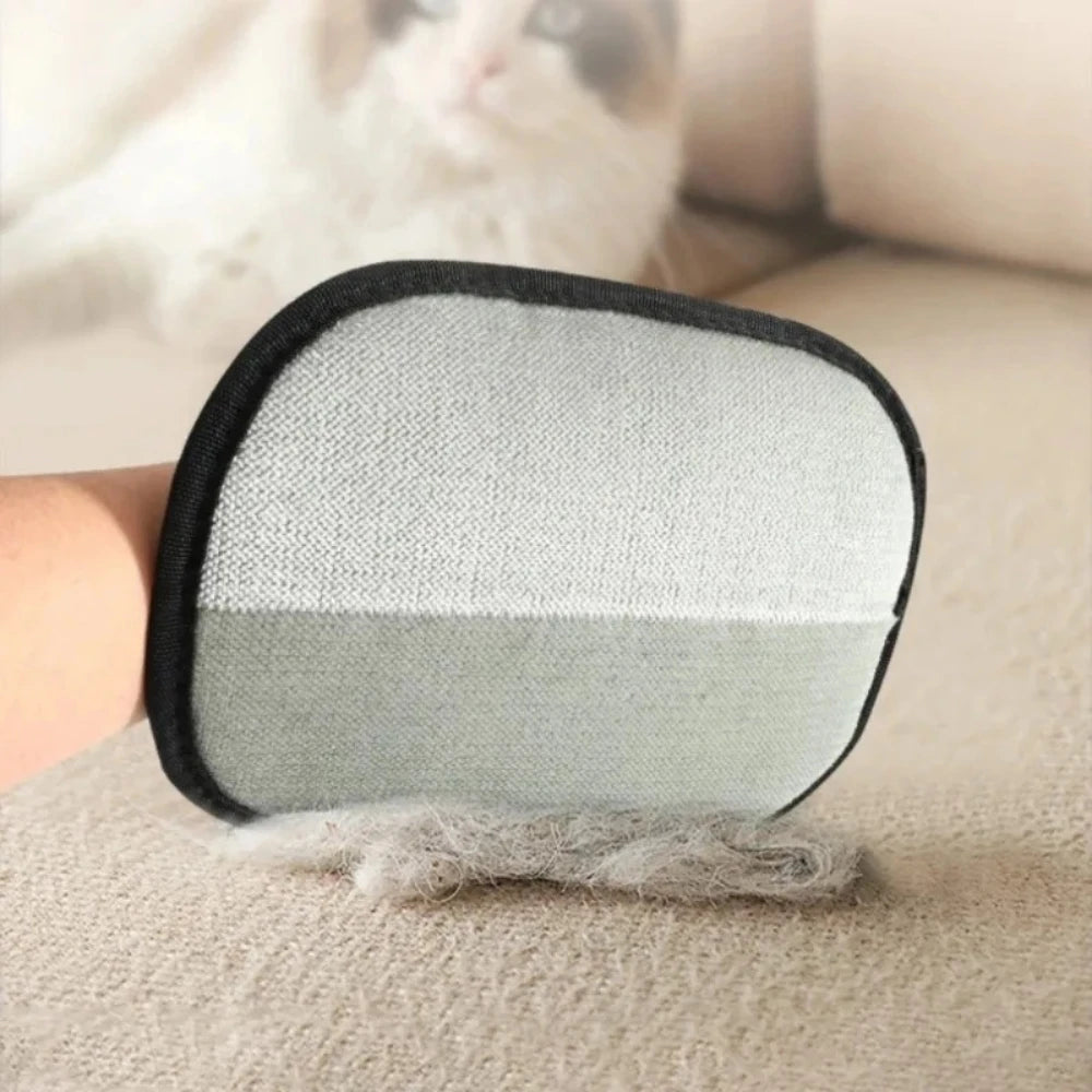 A double-sided pet grooming glove for cats and dogs, featuring a gray and black textured pad.