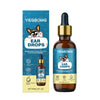 A bottle of Yegbong Ear Drops for pets with a dark brown glass and gold cap, next to its packaging.
