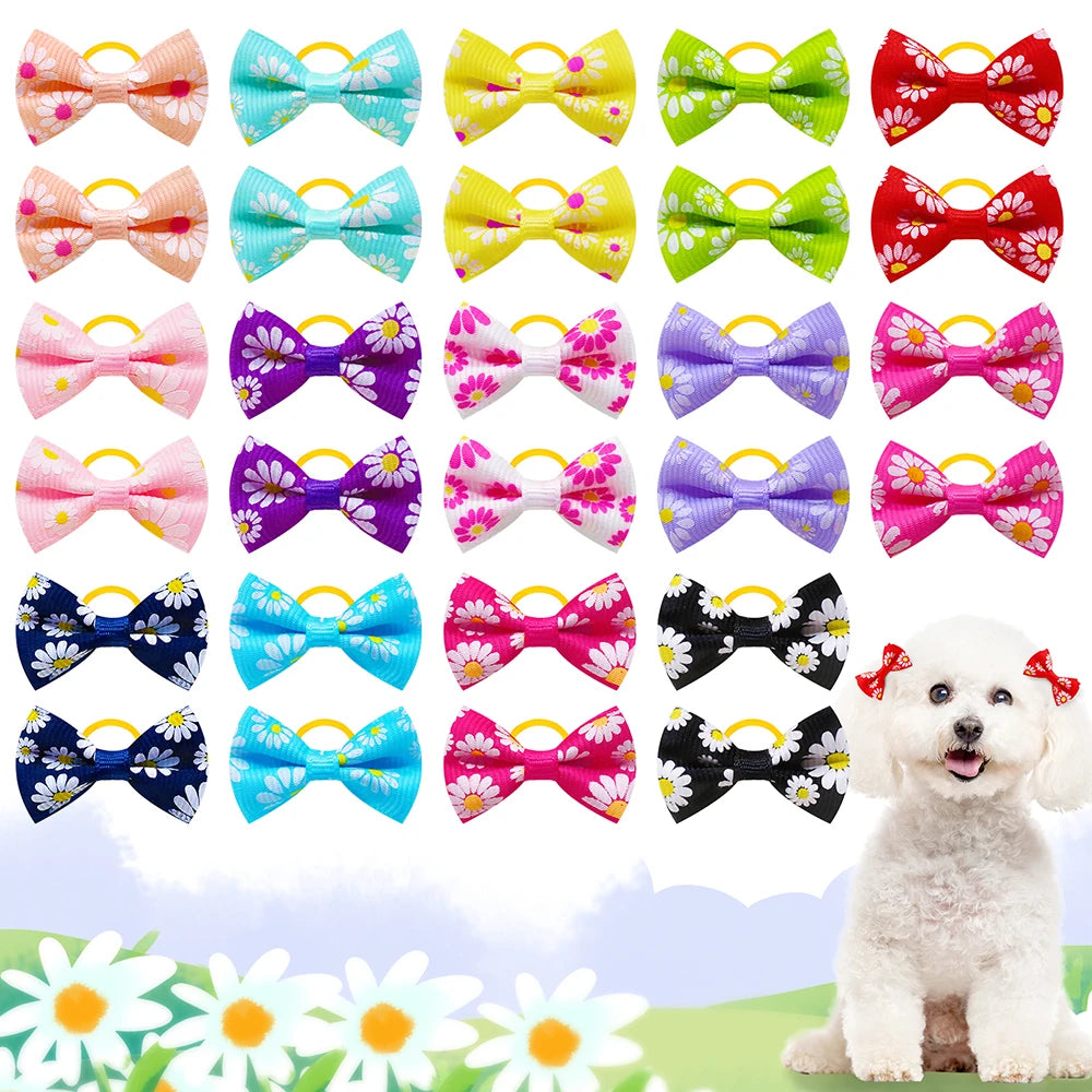 A collection of colorful pet hair bows in various patterns and colors with rubber bands displayed against a soft background.