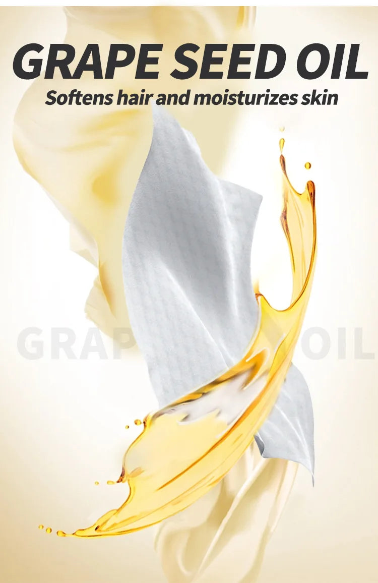 A close-up of grape seed oil dripping onto a white fabric, highlighting its moisturizing properties for hair and skin.