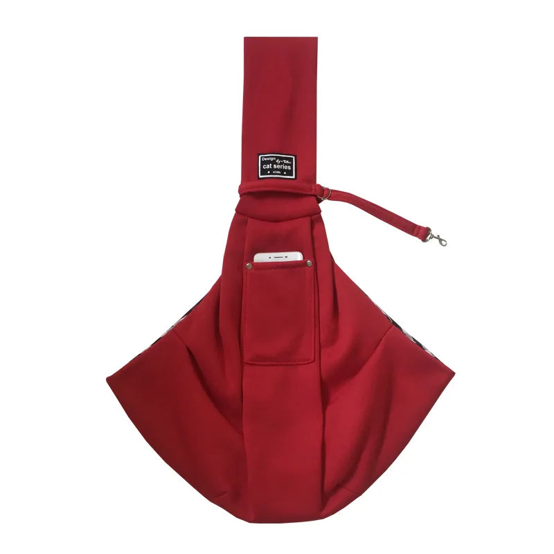 A maroon pet carrier sling bag designed for dogs and cats.