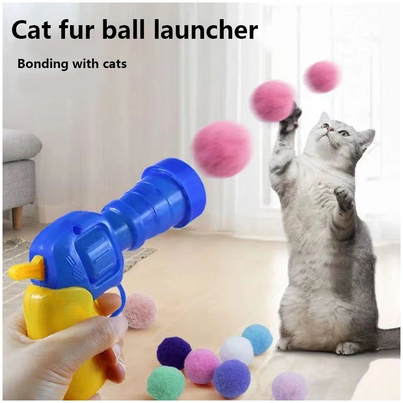 Eine Katze spielt mit einem blauen und gelben Fellballwerferspielzeug, das die Bindung zu Katzen demonstriert.