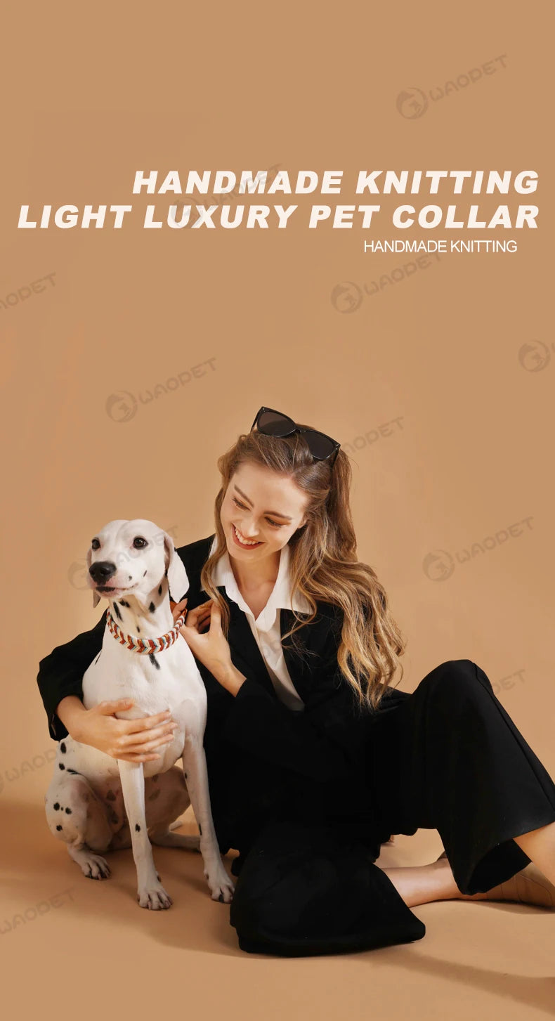 A woman is wearing a handmade knitting light luxury pet collar while sitting on the floor.