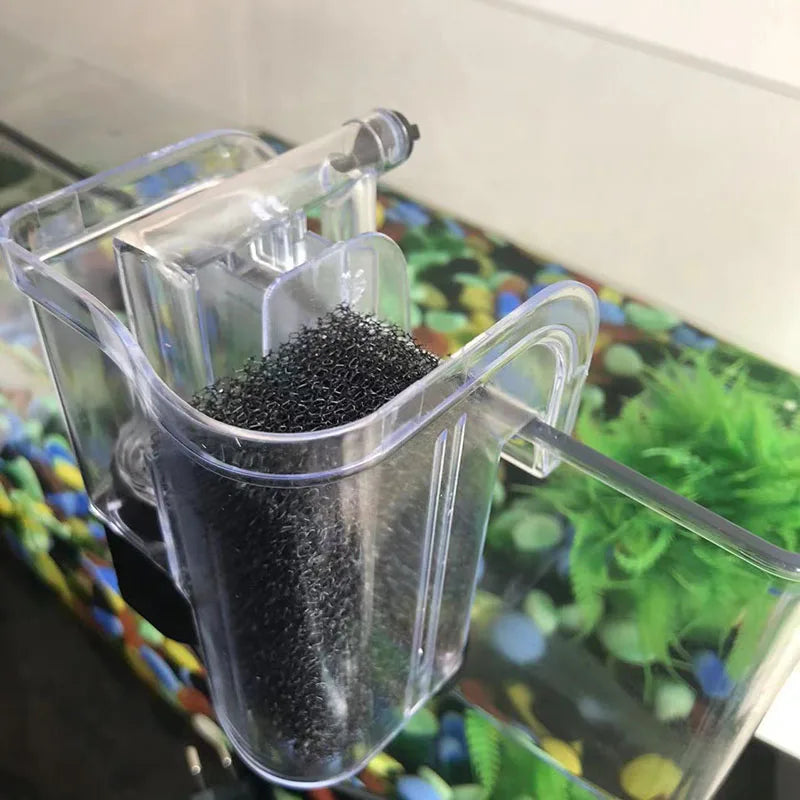 Two clear plastic containers holding black aquarium bio sponge filter media.
