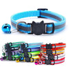A set of reflective cat collars in various colors including blue, black, and striped patterns with breakaway buckles and bell