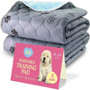 A stack of gray quilted washable training pads with paw prints and a pink card indicating 2 pack.