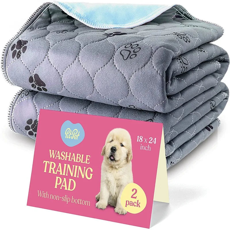 A stack of gray quilted washable training pads with paw prints and a pink card indicating 2 pack.