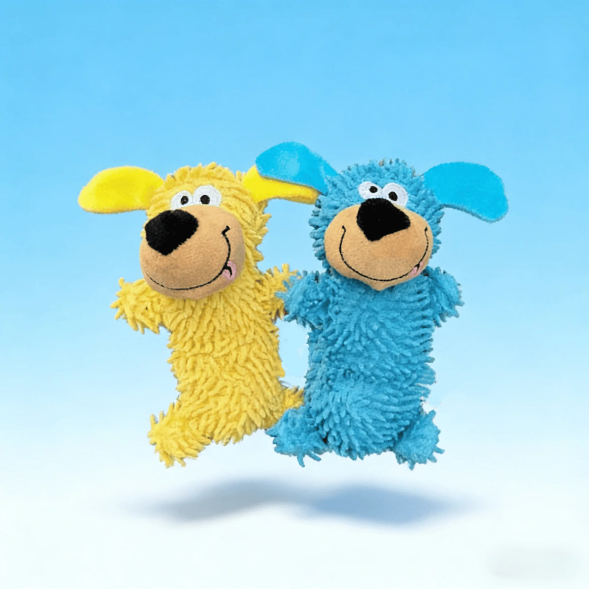 Two plush dog toys, one yellow and one blue, are shown against a light blue background.