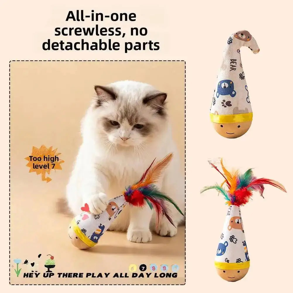 A white cat playing with an all-in-one screwless, no detachable parts feather wobble ball toy.