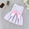 A pink and white striped summer bow dress for a small pet, featuring a large pink satin bow.