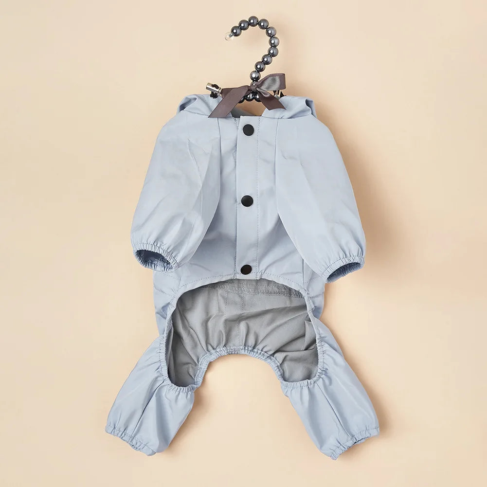 Light blue waterproof reflective dog raincoat and jumpsuit with a bow detail