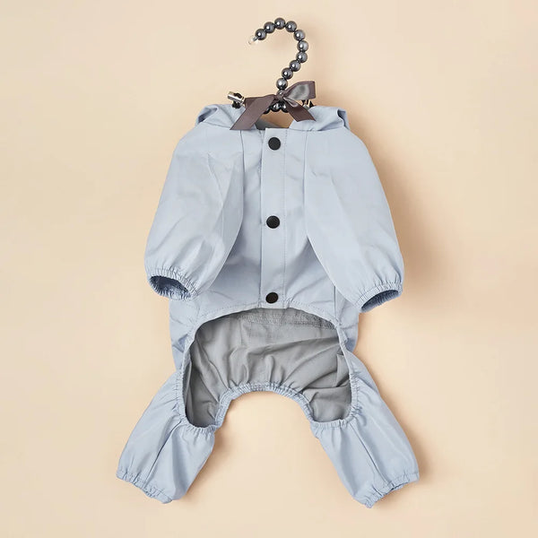 Light blue waterproof reflective dog raincoat and jumpsuit with a bow detail