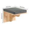 A wall-mounted cat tree featuring scratching stairs and a hammock, made of light wood and gray fabric.