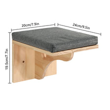 A wall-mounted cat tree featuring scratching stairs and a hammock, made of light wood and gray fabric.