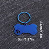 A bright blue bone-shaped dog ID tag with a circular keyring, shown against a dark gray background.