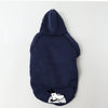 Navy blue cozy fleece dog sweatshirt with a hood and pocket featuring a white cartoon dog face.