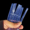 A hand holds several clear blue PVC flexible tubing for various water applications.
