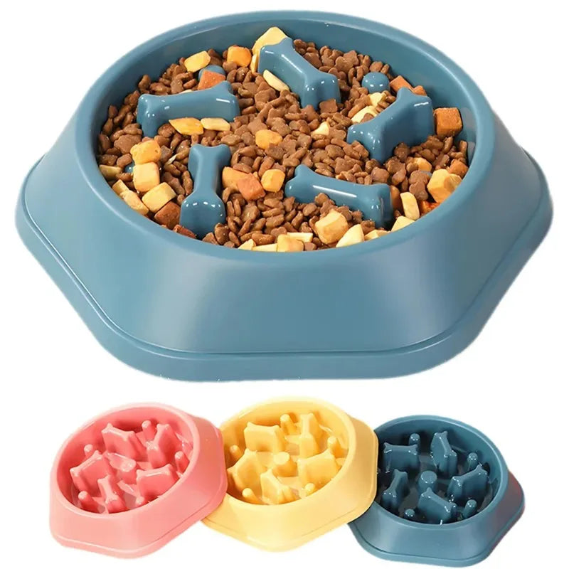 A set of anti-choking slow feeder dog bowls with puzzle designs in pink, yellow, and blue colors.