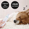 A hand holds an electric pet nail grinder near a sleeping dog.