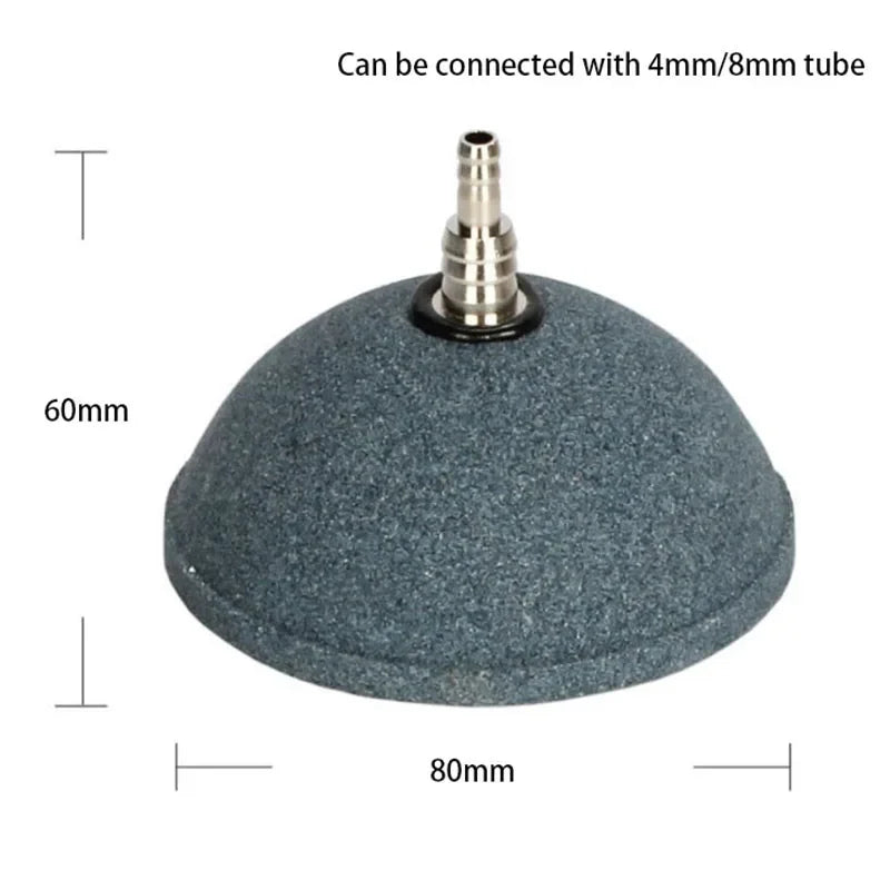 A round, dark gray air stone disc with a threaded connection for fish tank oxygenation.