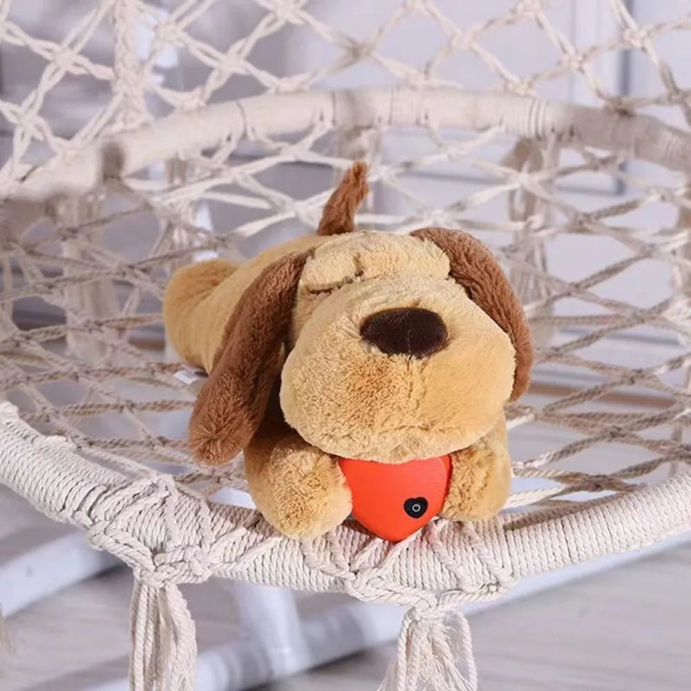 A fluffy brown dog plush toy with an orange heart detail sitting on a woven basket.