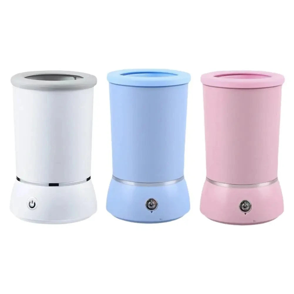 Three automatic pet paw cleaner cups in white, light blue, and pink colors.
