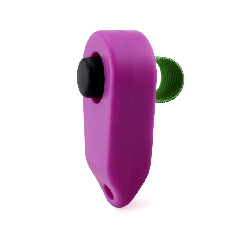A purple pet training clicker with a black trigger and a green silicone tip.