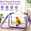 A clear, breathable bird travel carrier with a purple strap, holding a small parrot.