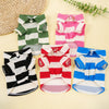 A collection of striped polo shirts for pets, including green and white, pink and white, and blue and white.
