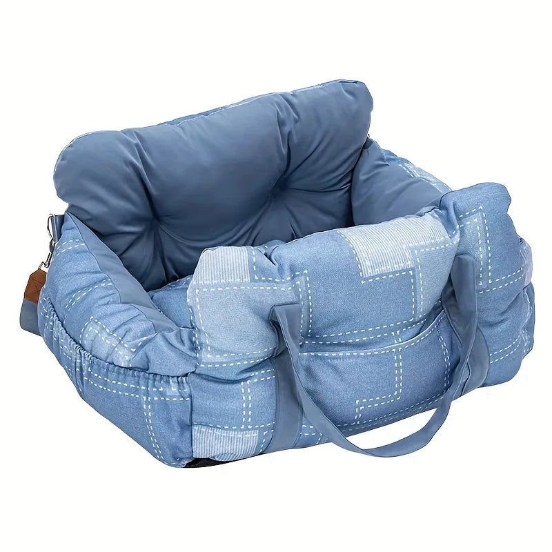 A light blue durable pet car seat with safety straps shown from above.