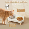 A white elevated cat feeding station with a guardrail and dining table for feeding cats.