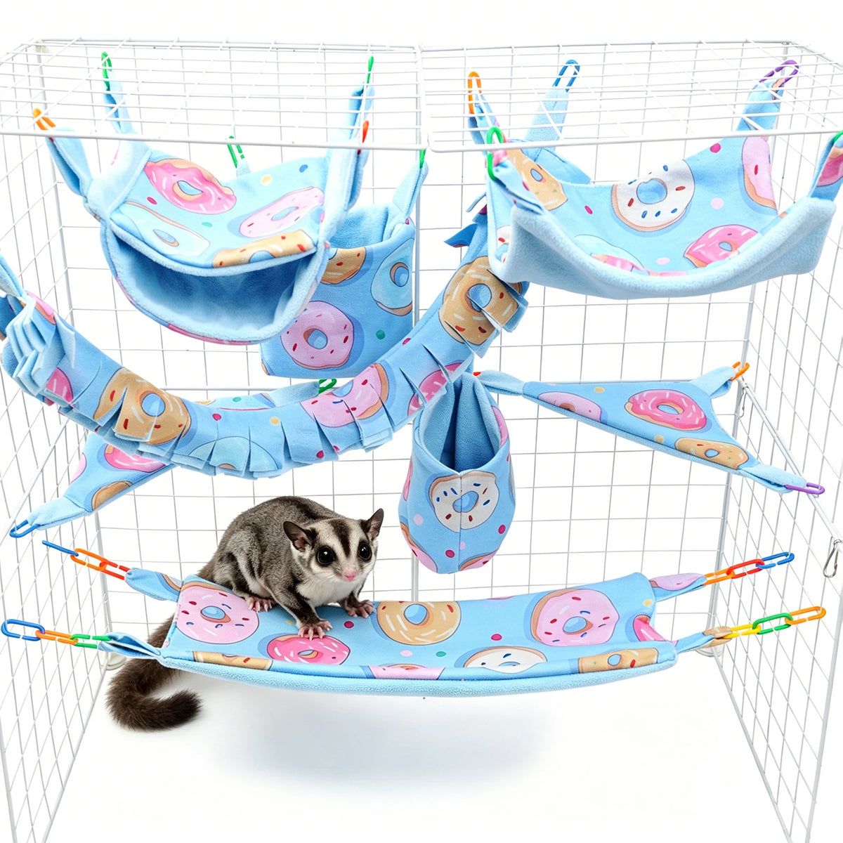 A multi-functional pet hammock and hideout set featuring colorful fabric hammocks for small pets inside a wire cage.
