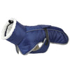 A navy blue reflective winter coat for dogs with a white fur trim.