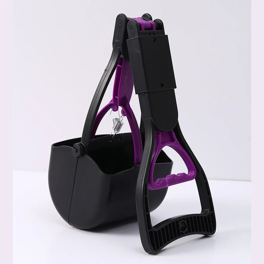 A black and purple portable foldable dog poop scooper with a handle and container.