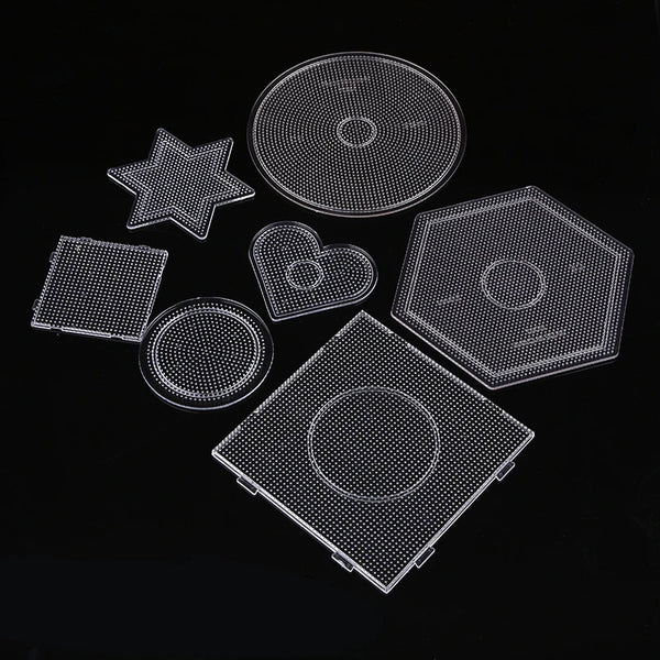 A collection of precision hama beads shapes and a tweezers kit laid out on a black background.