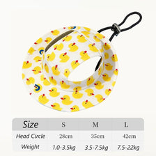 Yellow duck print pet cap for dogs with a black strap