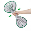 A hand is holding a replacement litter mat for a smart cat toilet, showing the fabric and green trim.