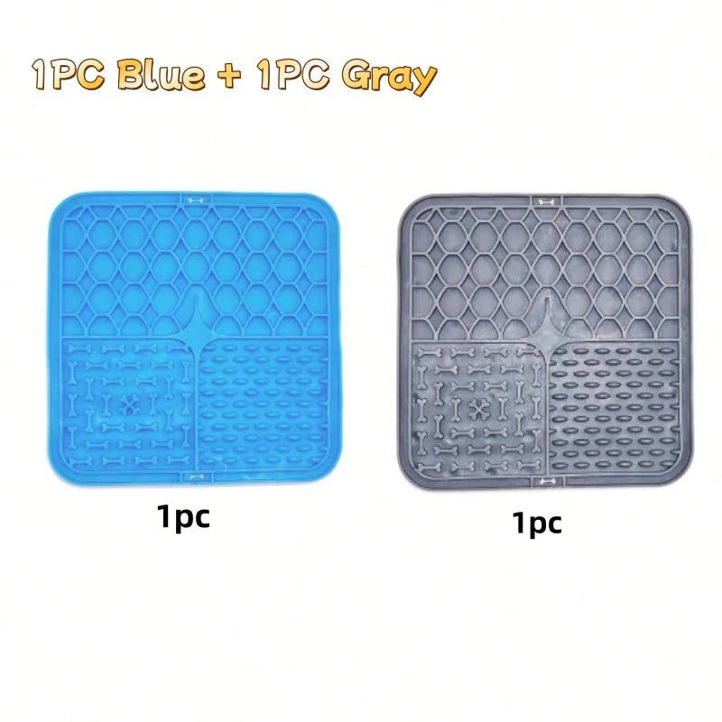 Two silicone mats for dogs, one blue and one gray, used for bathing and slow food training.