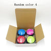 A cardboard box containing four colorful pet communication buttons for dog training.