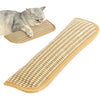 A fluffy gray cat is resting on a beige, textured scratching mat designed for cats.