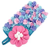 A colorful mat with pink and blue flowers used for interactive pet foraging.