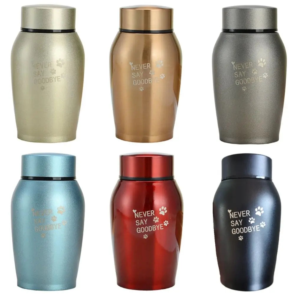 A collection of stainless steel pet memorial storage boxes in various colors including gold, copper, blue, red, and black.