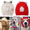 A set of cozy knit ear muffs for dogs, shown on a beige and red knitted hat and worn by three different dog breeds.